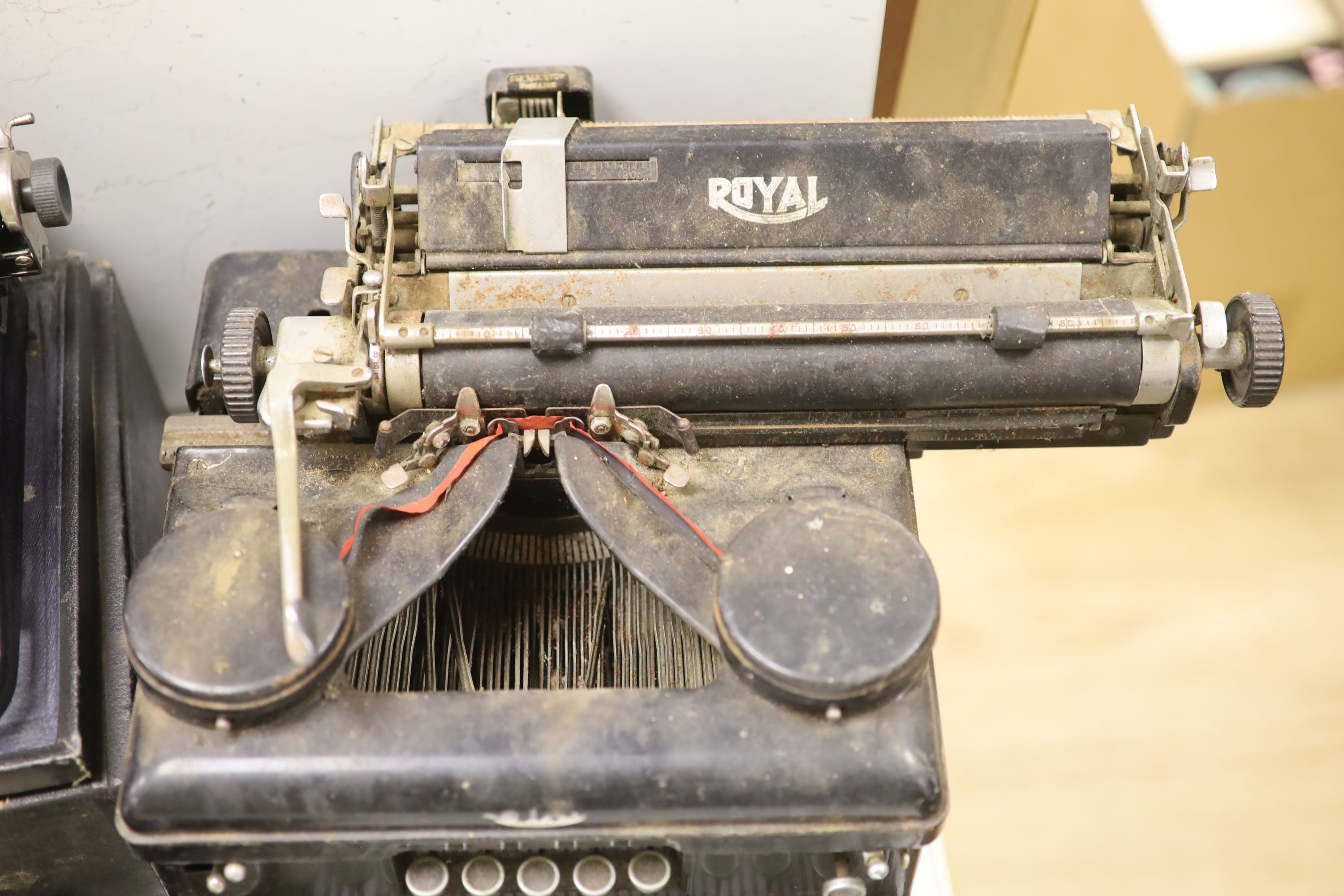 Three vintage typewriters: Underwood Standard portable, Remington Portable and Royal Typewriter Company